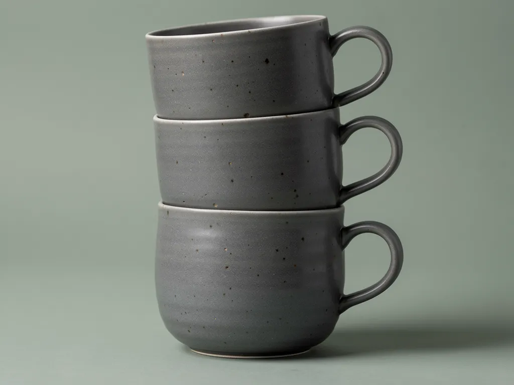 Stacked set of three graphite ceramic mugs