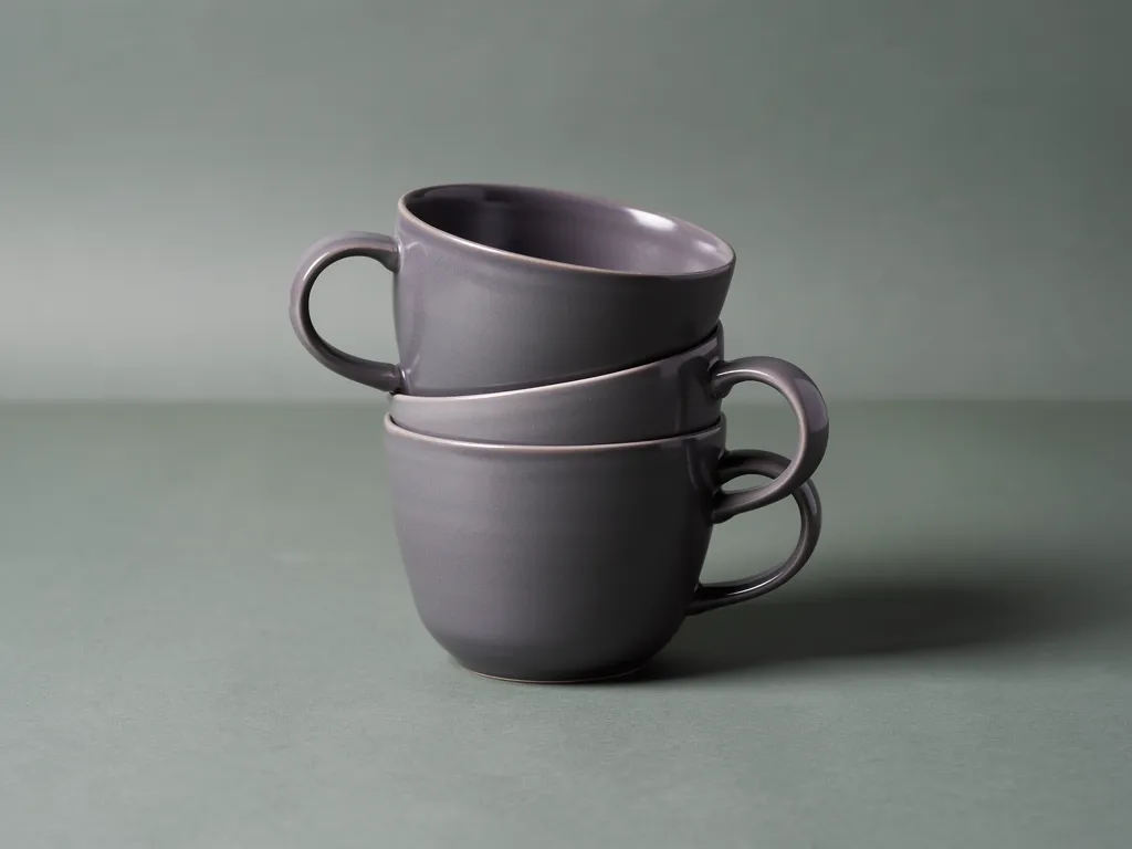 Stacked set of three graphite ceramic mugs